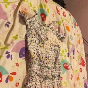 Old Navy brand new it has flowers it’s originally white and it’s a jumpsuit
